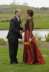 long, glamorous, red wedding dress from the side